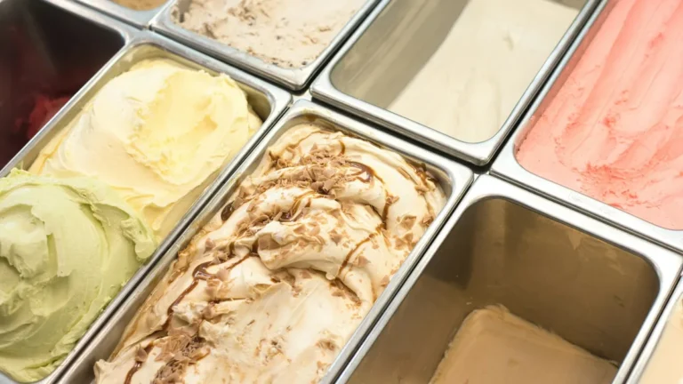 Trays of ice cream flavours in a shop display