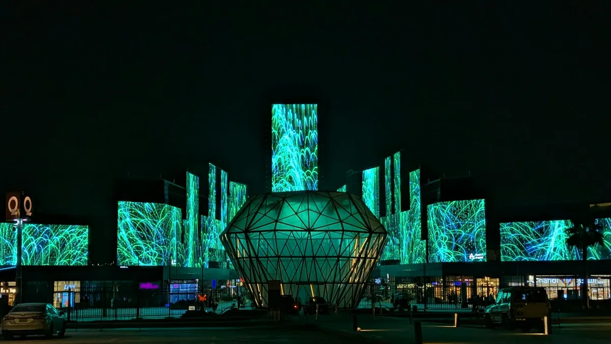 Glowing digital art screens at Boulevard Riyadh City at night