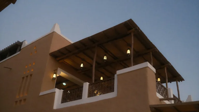 Traditional mud brick building with a wooden balcony in Diriyah
